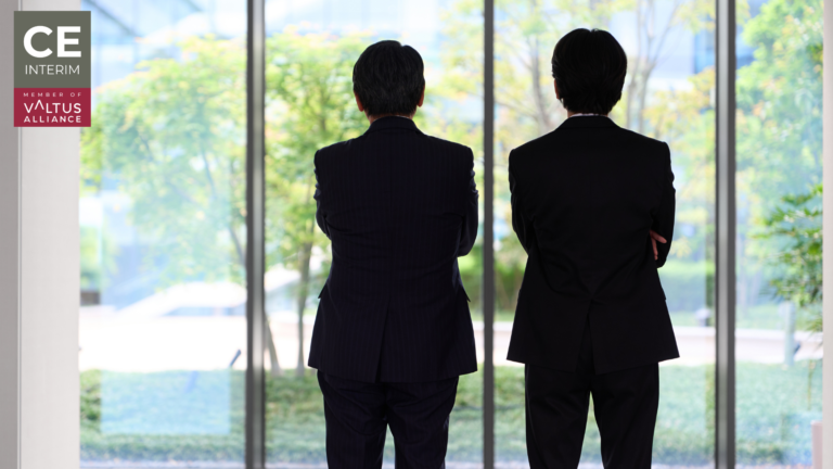 Two executives looking out of a window