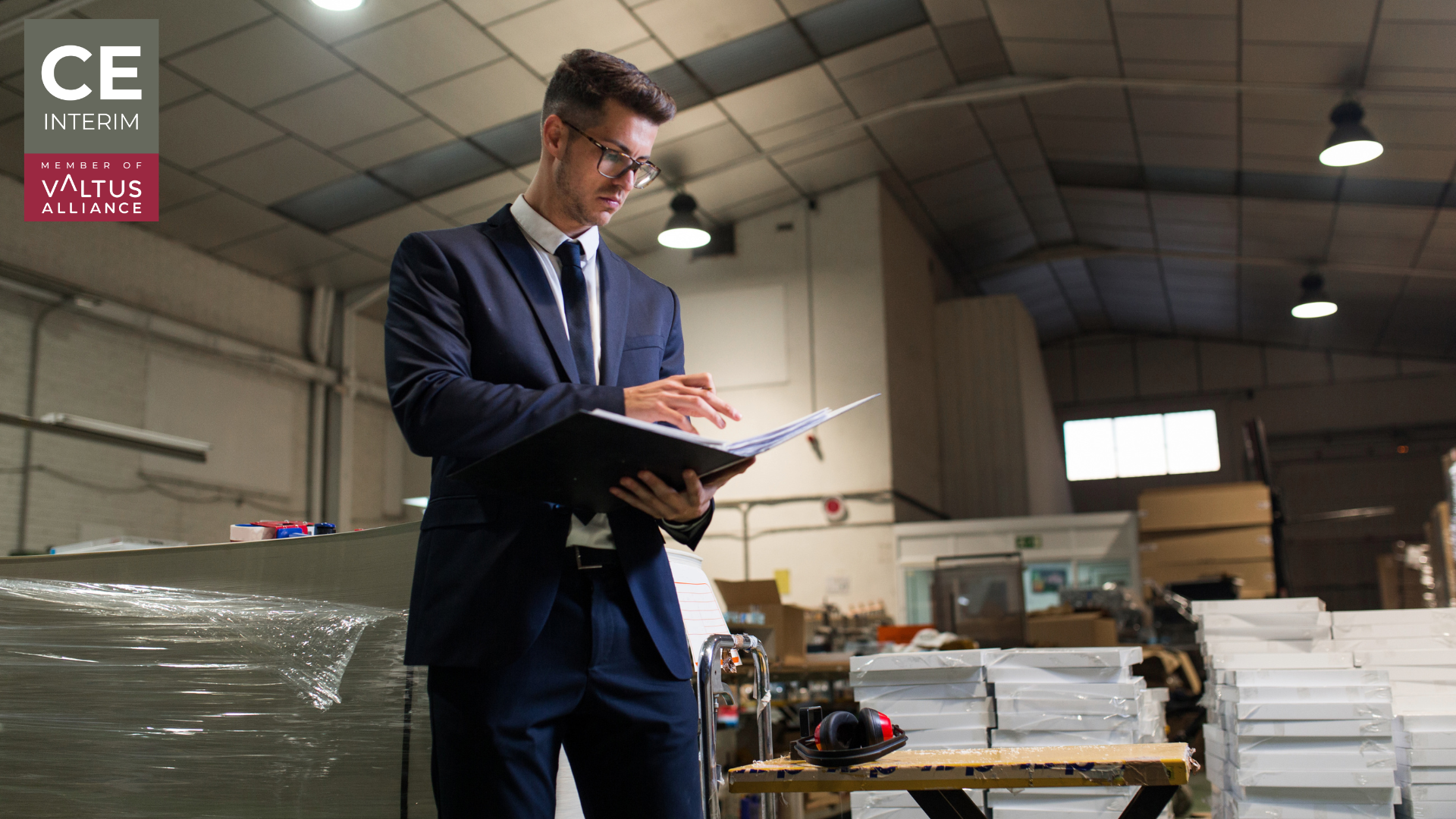 A senior executive physically inside a European manufacturing facility