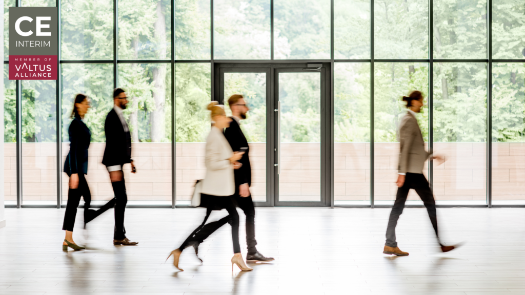 Employees walking inside a company building