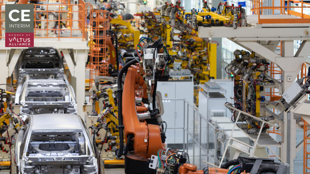 Modern automotive manufacturing assembly line with multiple production stations and operational equipment